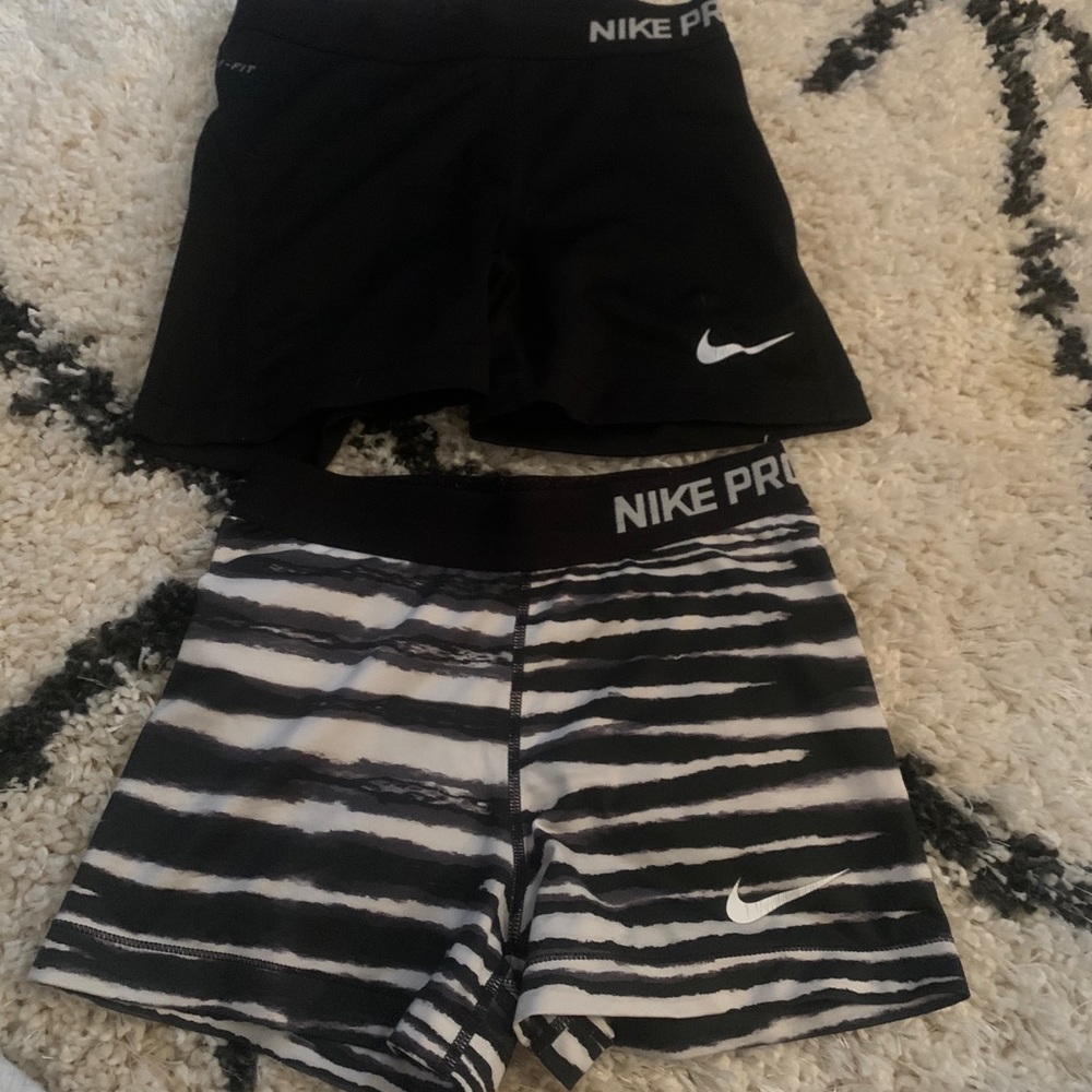 2 pairs of nike pros